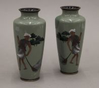 A pair of late 19th/early 20th century Japanese cloisonne vases decorated with Indian figures.