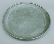 A Chinese pewter plate, engraved with dragon design, circa 1860,