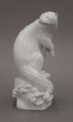 A Meissen blanc de chine model of an otter. 24.5 cm high.