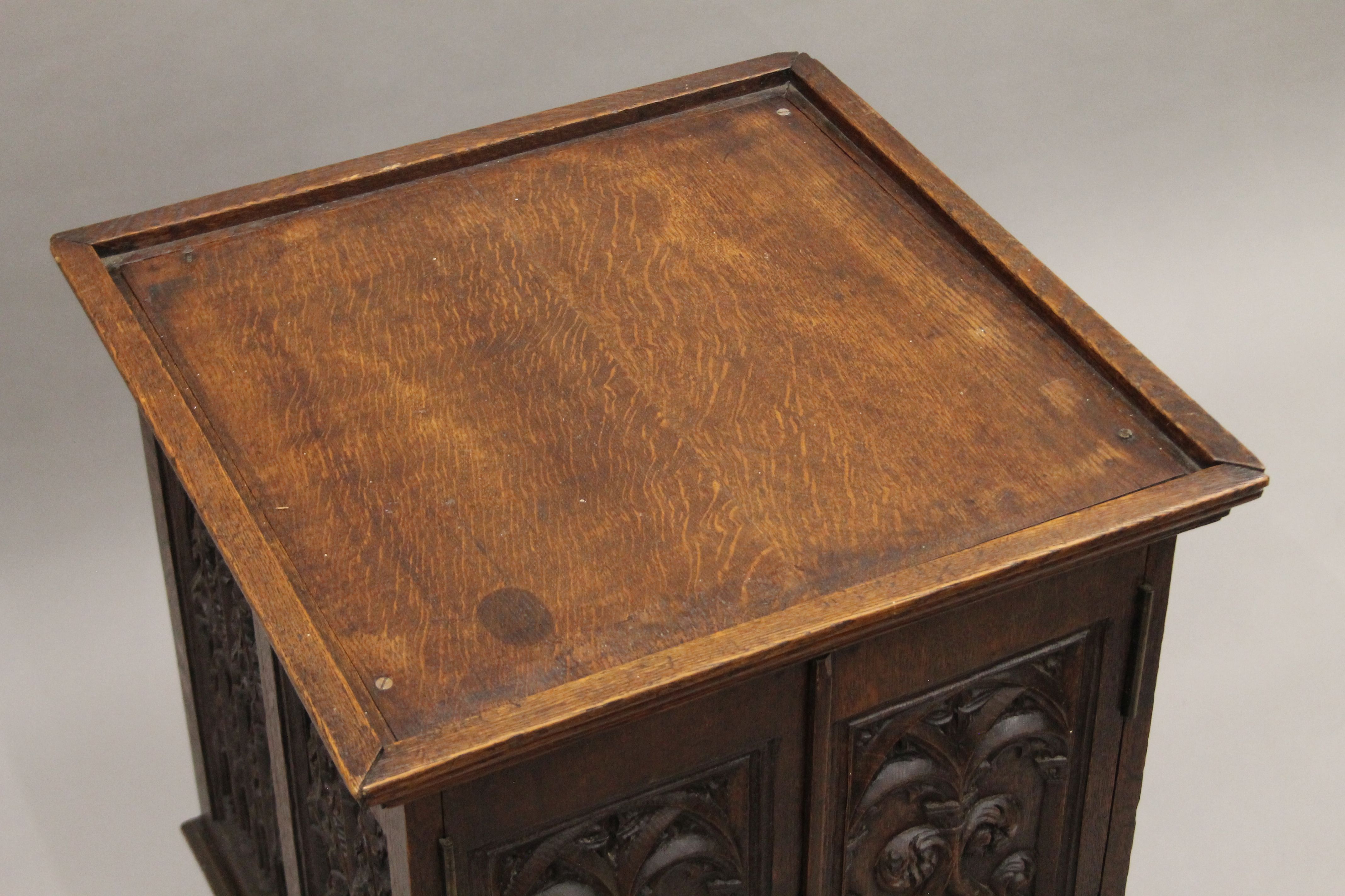 A small Victorian carved oak Gothic Revival cabinet with base drawer. 51.5 cm square. - Image 3 of 7