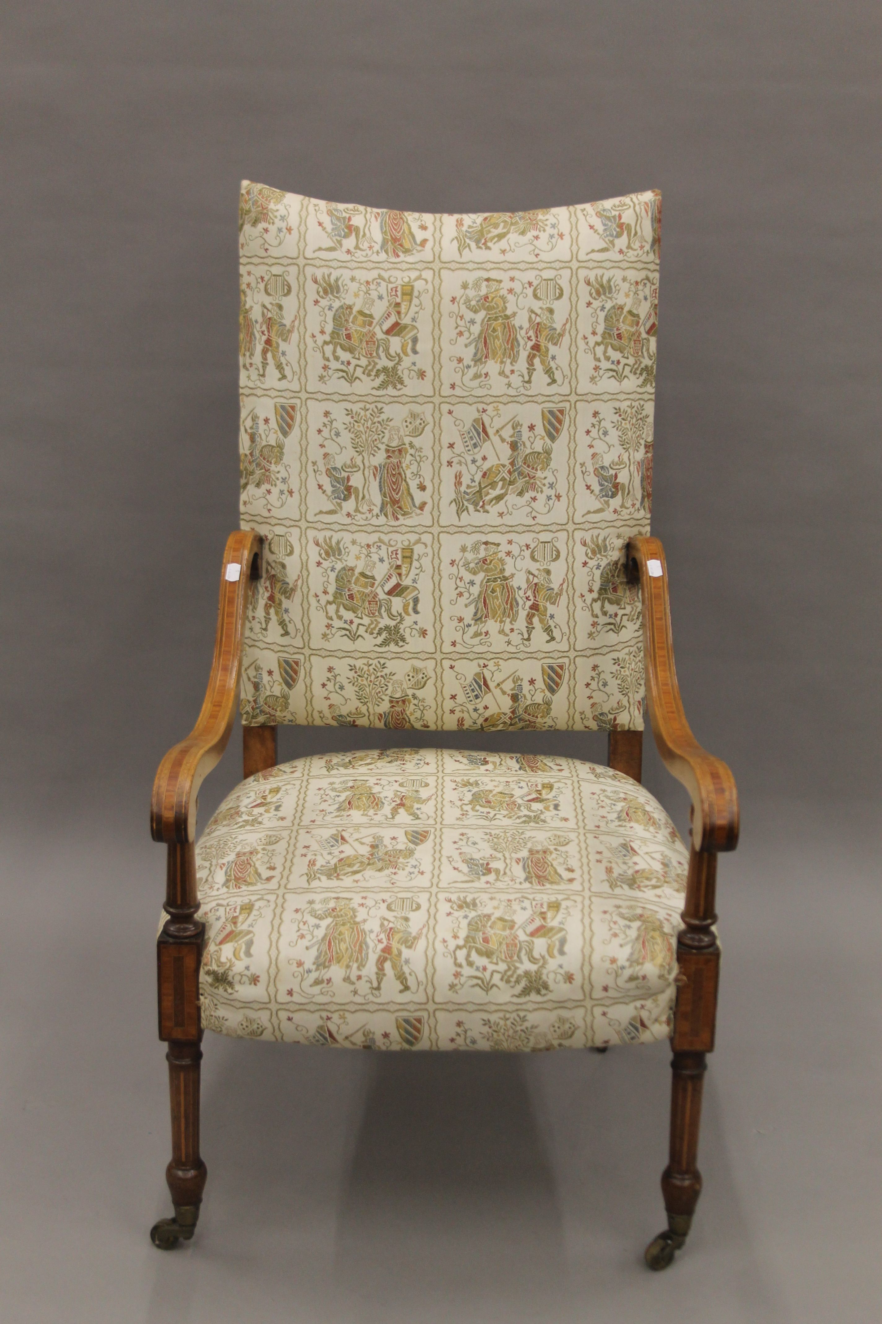 An Edwardian upholstered inlaid mahogany open armchair. 62 cm wide.