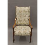 An Edwardian upholstered inlaid mahogany open armchair. 62 cm wide.