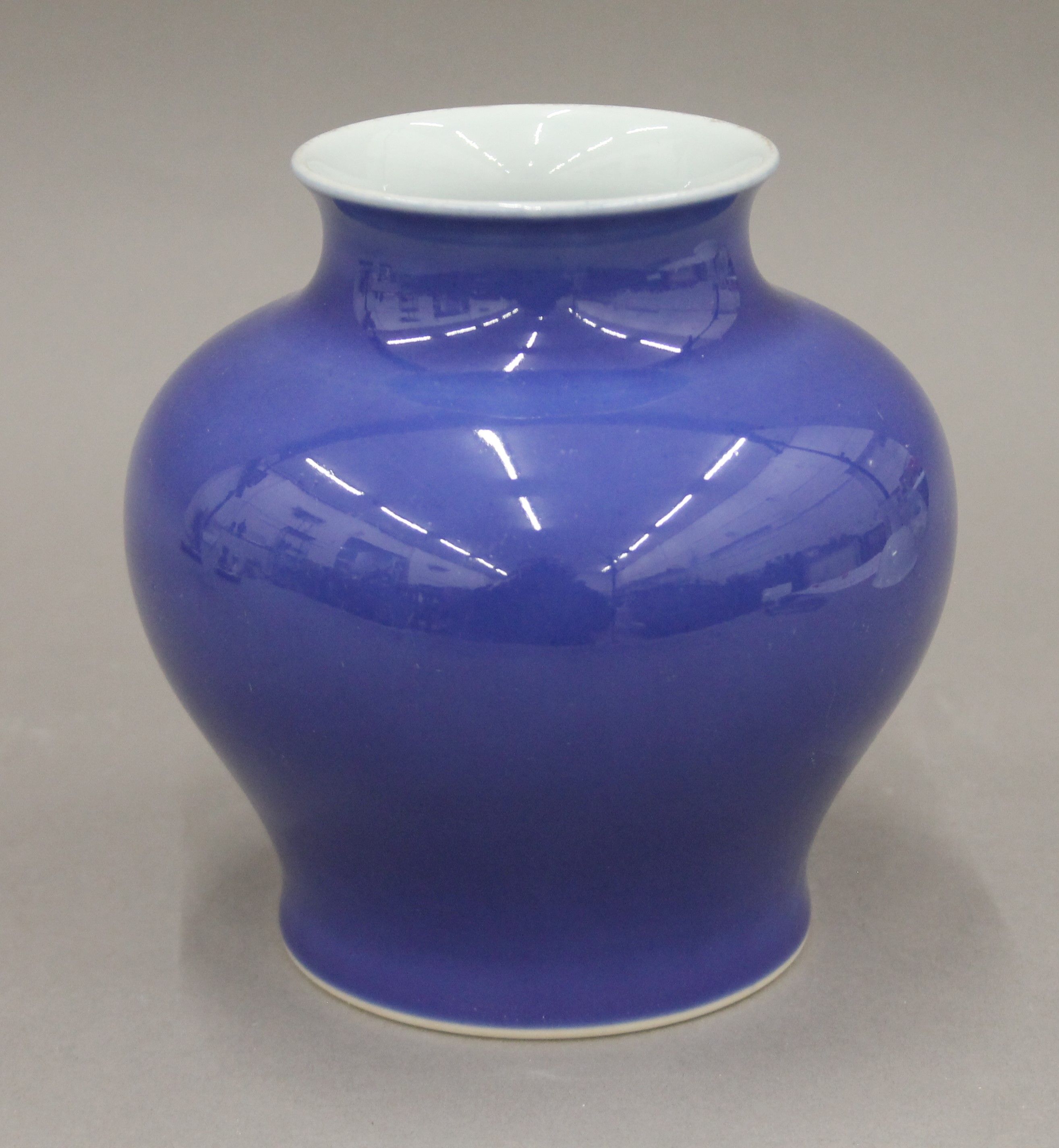 A Chinese porcelain blue ground vase of baluster form, with six character mark to base. 14.