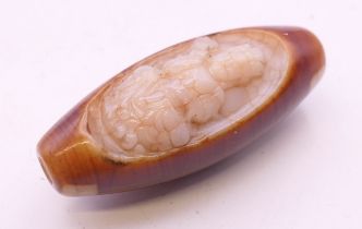 An agate dzi bead. 5 cm high.
