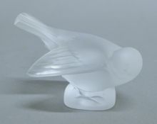 A Lalique glass bird. 7.5 cms high.
