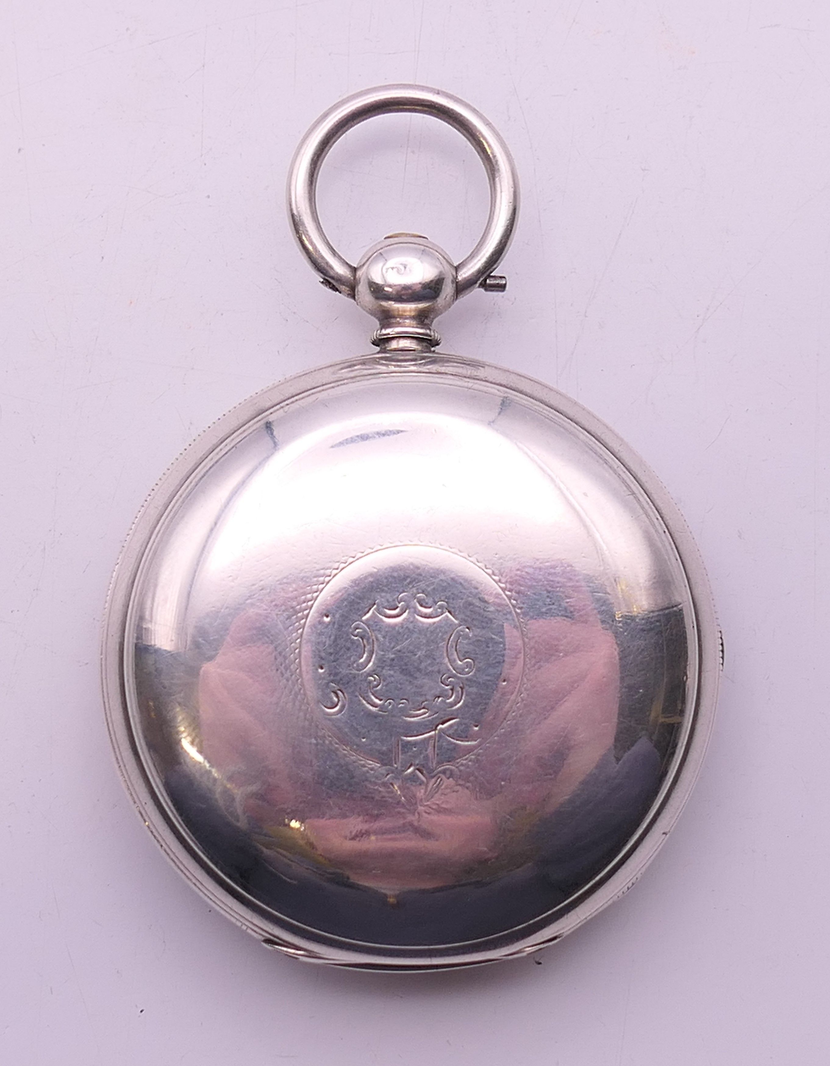 A silver full hunter gentleman's pocket watch, hallmarked for London 1876. 4.75 cm diameter.