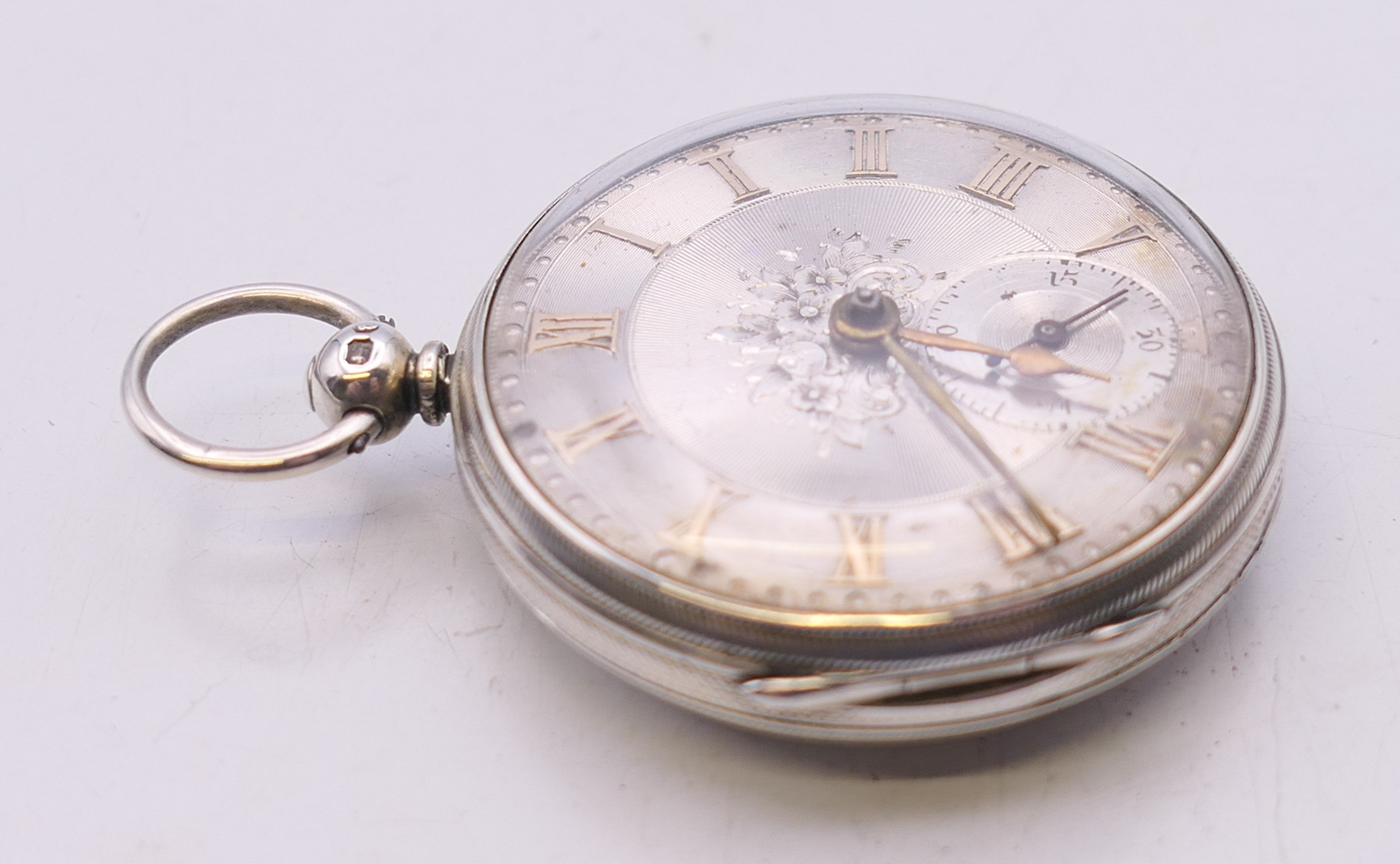 A silver pocket watch with engraved dial, hallmarked for London 1855. 4 cm diameter. - Image 3 of 6