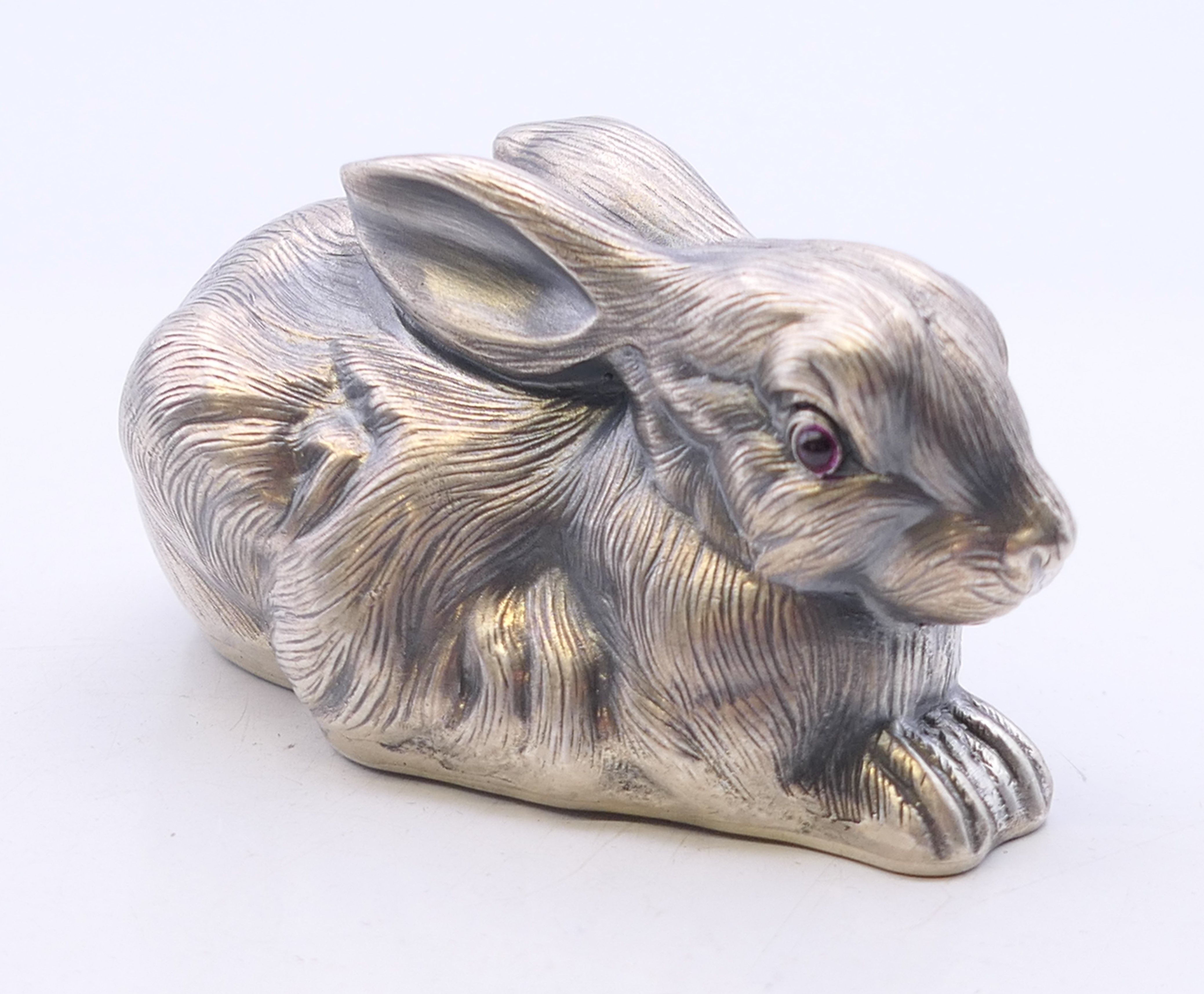 A silver model of a rabbit bearing Russian marks. 6.5 cm long.