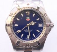 A boxed 2000 series Tag Heuer gentleman's wristwatch. 4 cm wide.