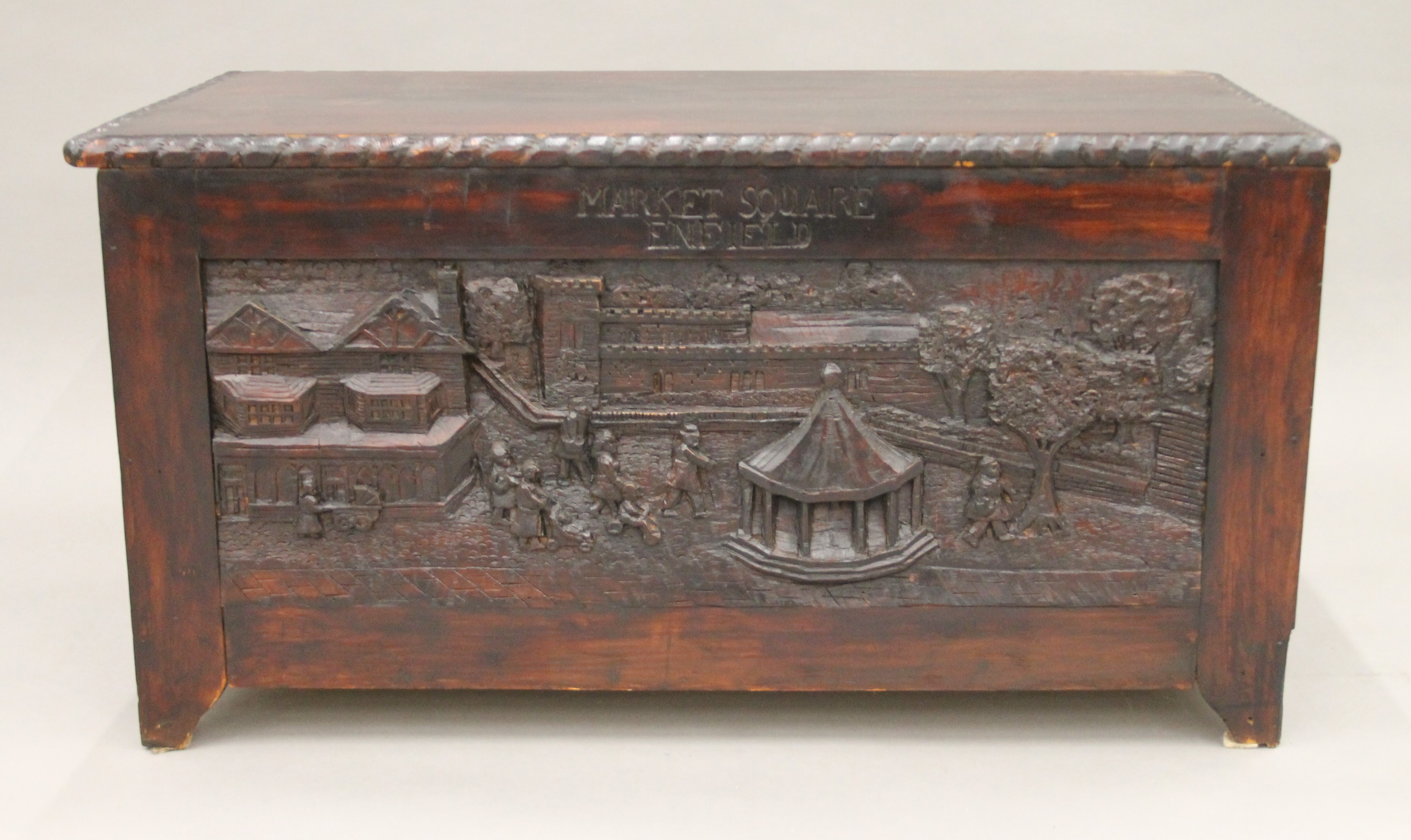 A trunk carved with scenes of Enfield. 88 cm long. - Image 2 of 7