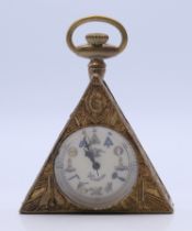 A brass Masonic-style pocket watch. 6 cm high.