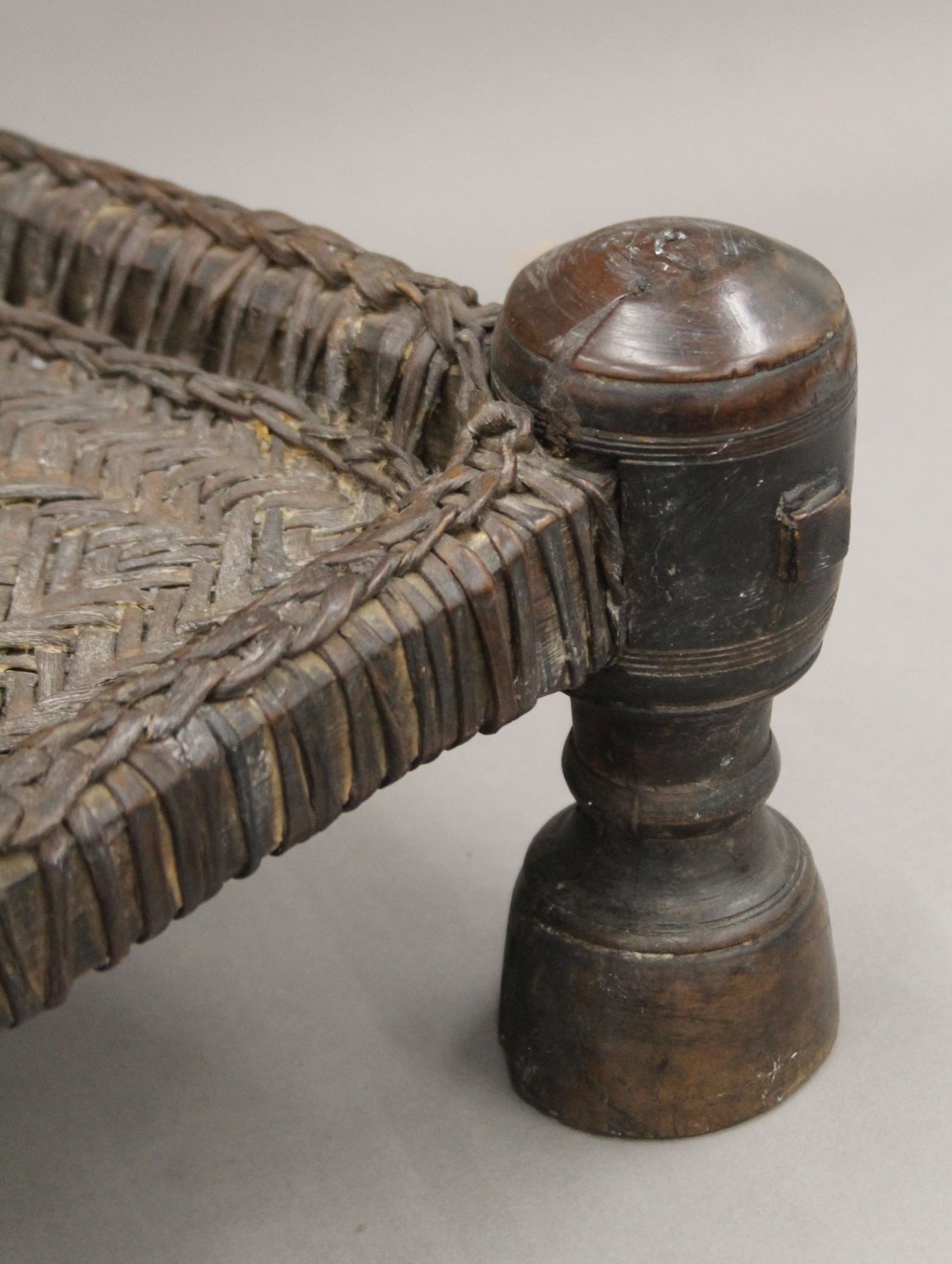 An Indian antique low hardwood chair with reeded seating. 64 cm high. - Image 3 of 5