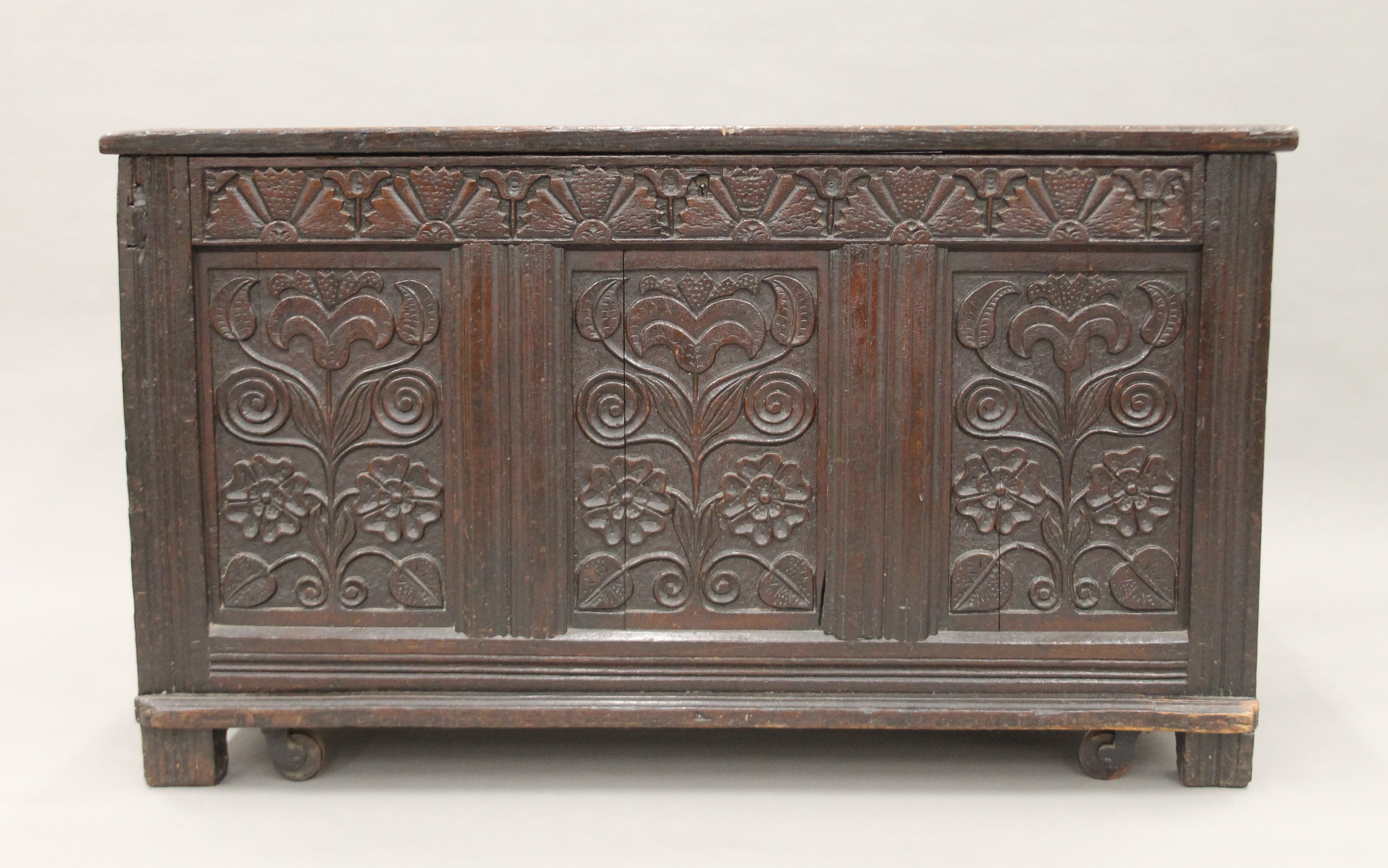 An 18th century carved oak coffer. 123 cm long. - Image 2 of 6