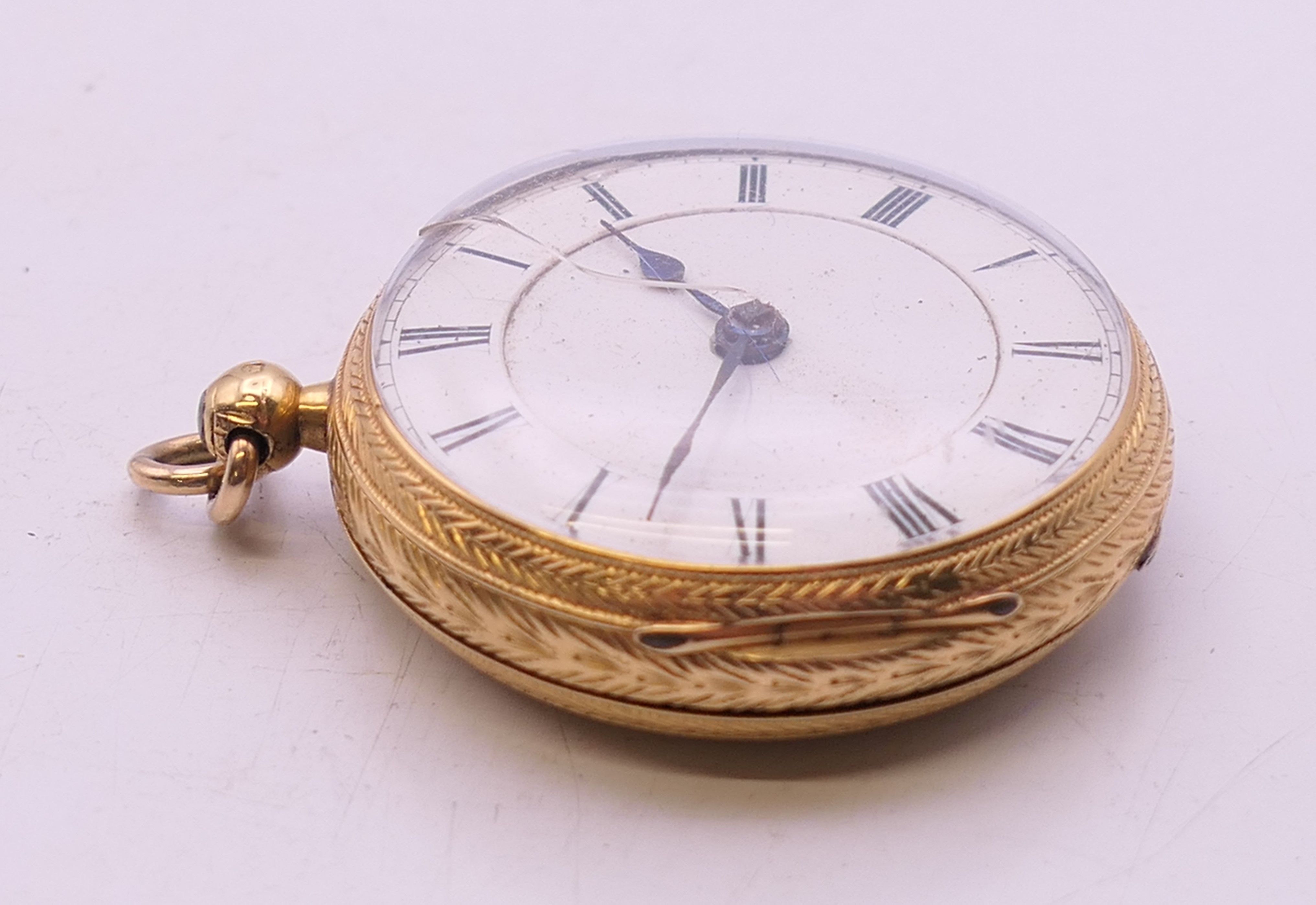 An 18 K gold open-faced pocket watch. 4 cm diameter. 61.8 grammes total weight. - Image 4 of 10