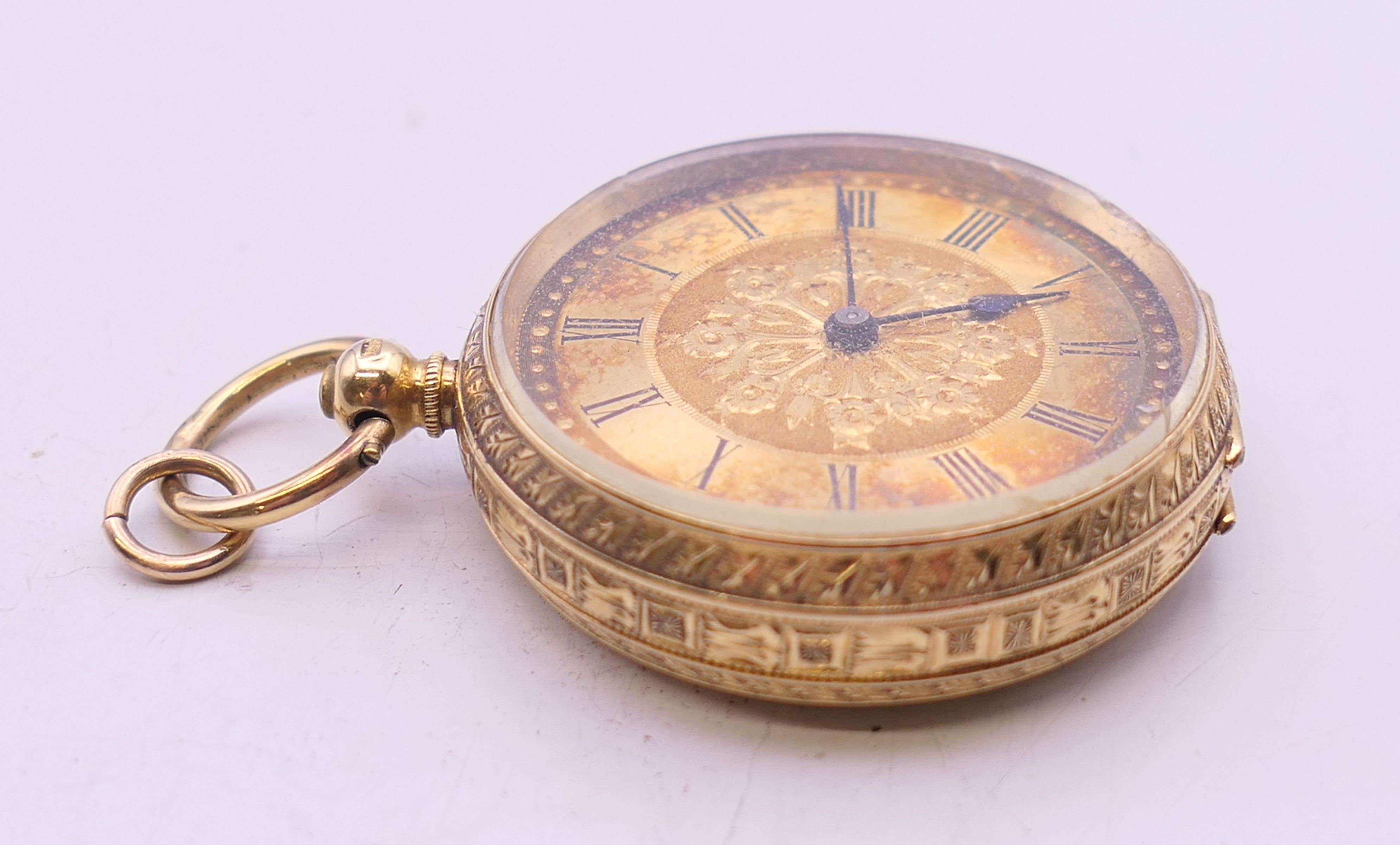 An 18 K gold cased open face pocket watch. 3.5 cm diameter. 42.5 grammes total weight. - Image 3 of 7
