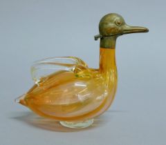 A glass duck decanter. 21 cm long.