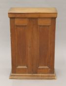 A late 19th century small walnut two-door cupboard. 45 cm wide x 66.5 cm high x 25.5 cm deep.