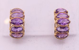 A pair of 14 k gold and amethyst earrings. 1.5 cm high. 4.3 grammes total weight.