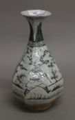 A Chinese porcelain black and white octagonal pottery vase. 33 cm high.