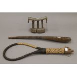 An African tribal wooden head rest, a scoop and a whip. The former 14 cm wide.