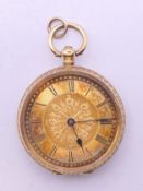 An 18 K gold cased open face pocket watch. 3.5 cm diameter. 42.5 grammes total weight.