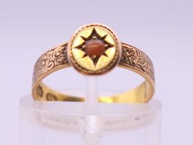 A Victorian 18 ct gold coral set ring. Ring size H/I. 1.9 grammes total weight.