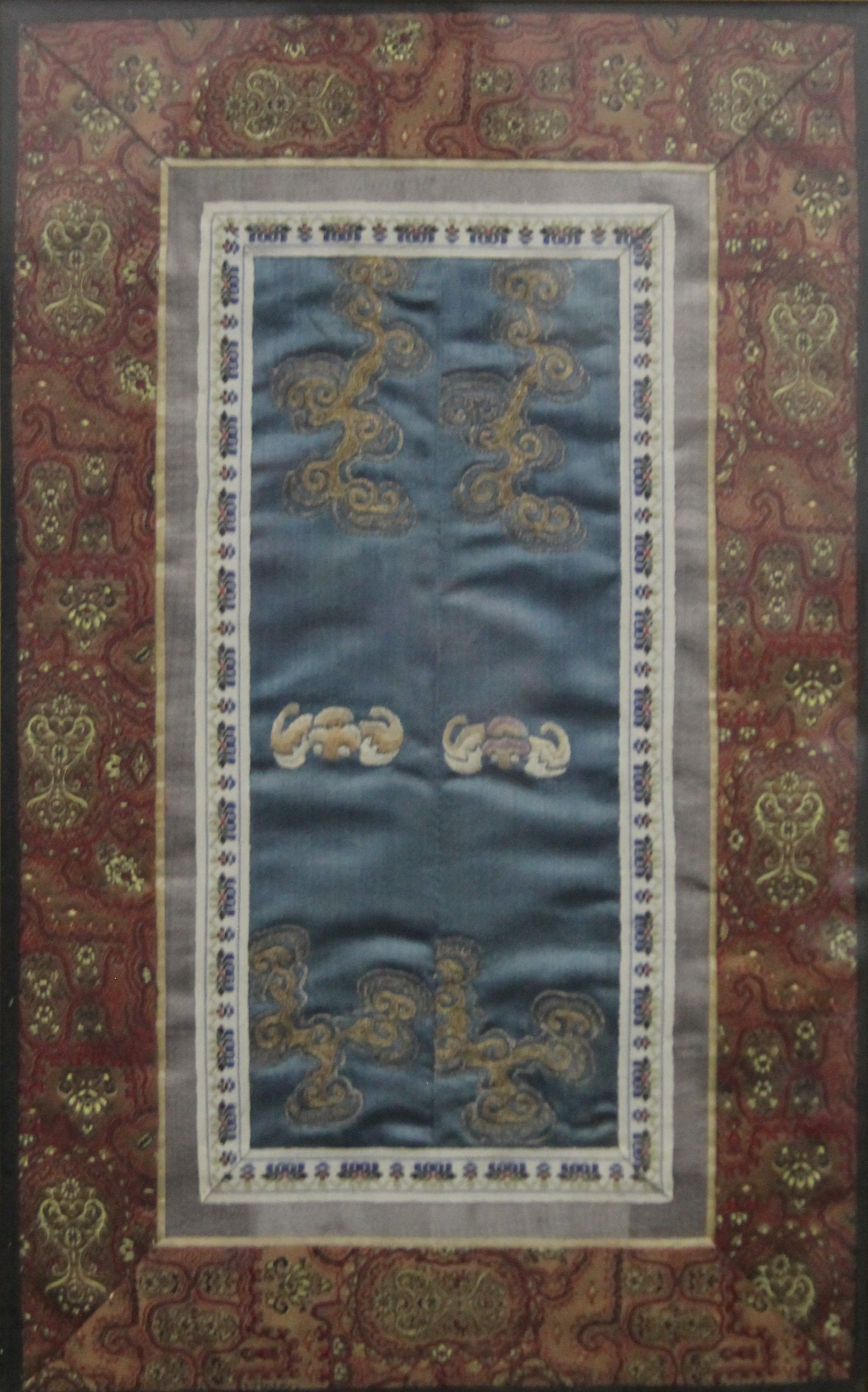 A Chinese embroidered sleeve panel, framed and glazed. 22 x 34 cm.