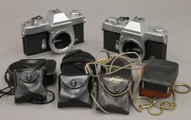 Five classic camera light meters with Olympus FTL screwmount SLR's.