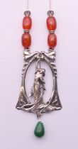 A silver Art Nouveau style pendant necklace. The pendant 8 cm high.