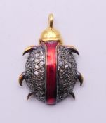 A diamond-set charm formed as a beetle. 2 cm high.