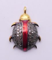 A diamond-set charm formed as a beetle. 2 cm high.