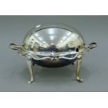A silver-plated serving dish/food warmer. 34 cm wide.