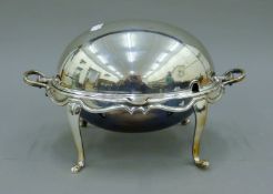 A silver-plated serving dish/food warmer. 34 cm wide.