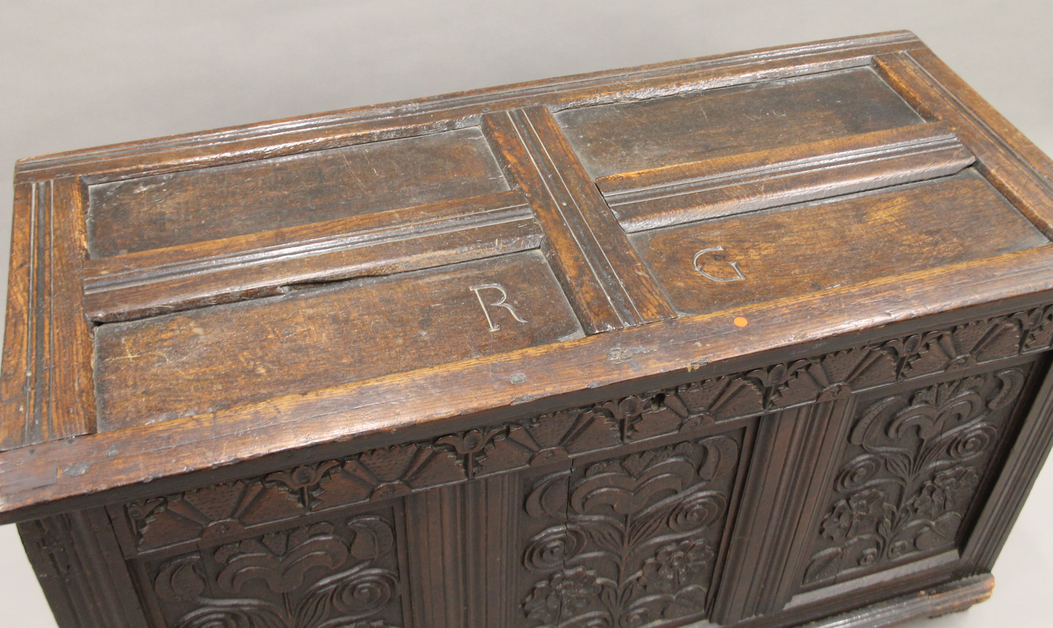 An 18th century carved oak coffer. 123 cm long. - Image 4 of 6