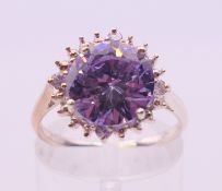 A silver amethyst and cubic zirconia ring. Ring size M/N.