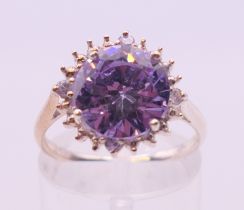 A silver amethyst and cubic zirconia ring. Ring size M/N.