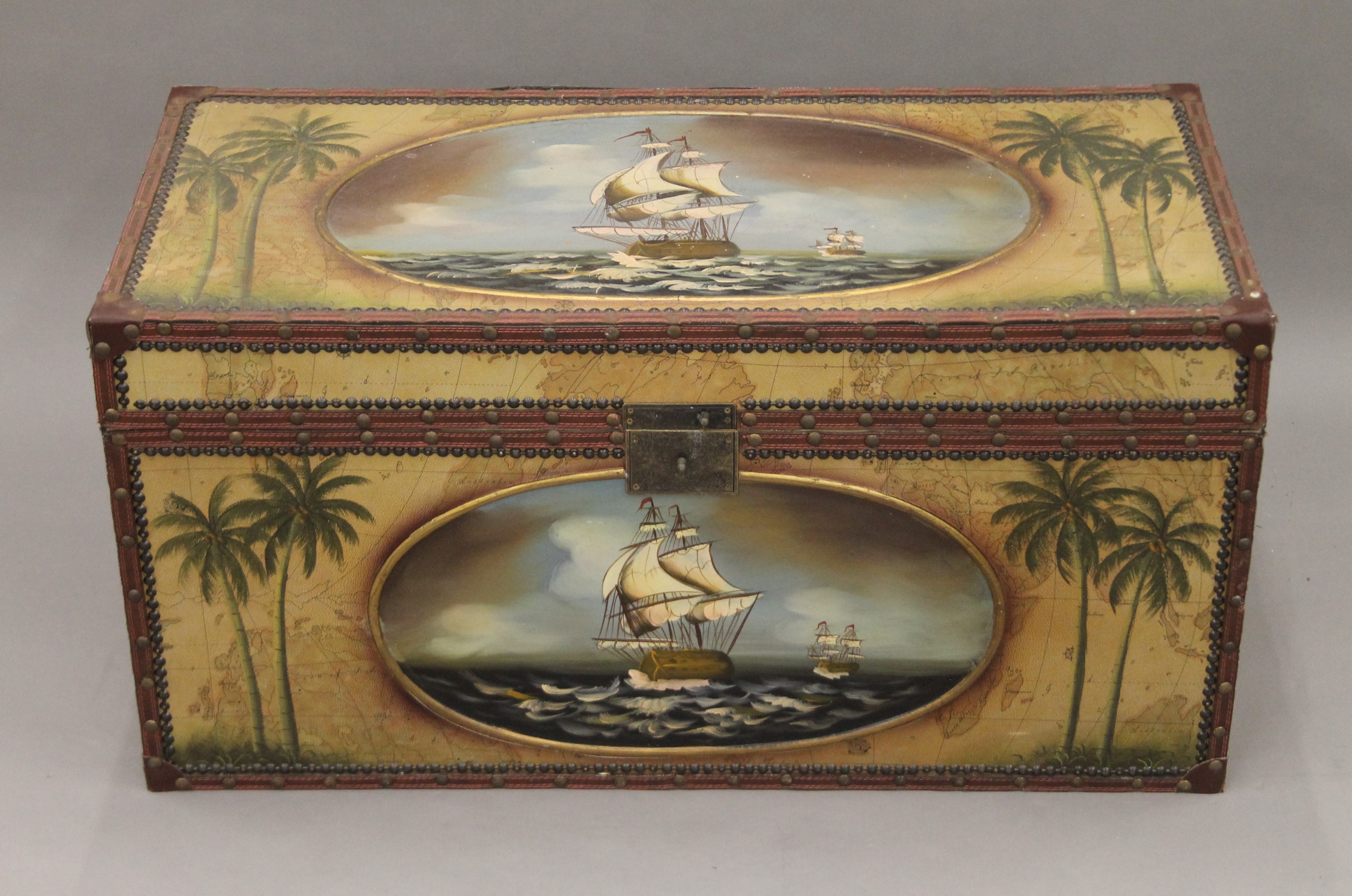 A trunk decorated with ships. 86 cm wide.