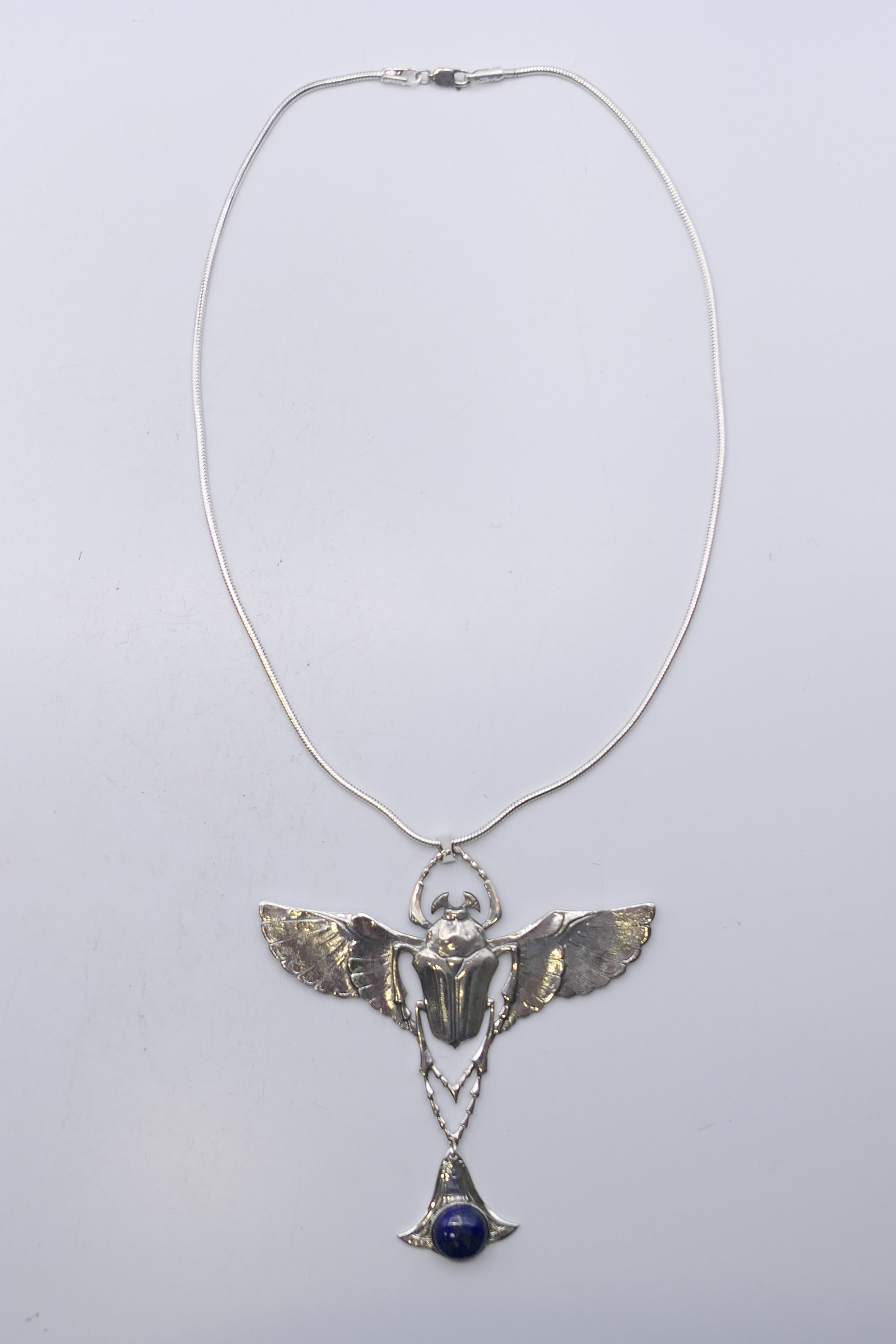 A silver lapiz-set scarab beetle pendant on chain. Pendant 9 cm high. - Image 2 of 5