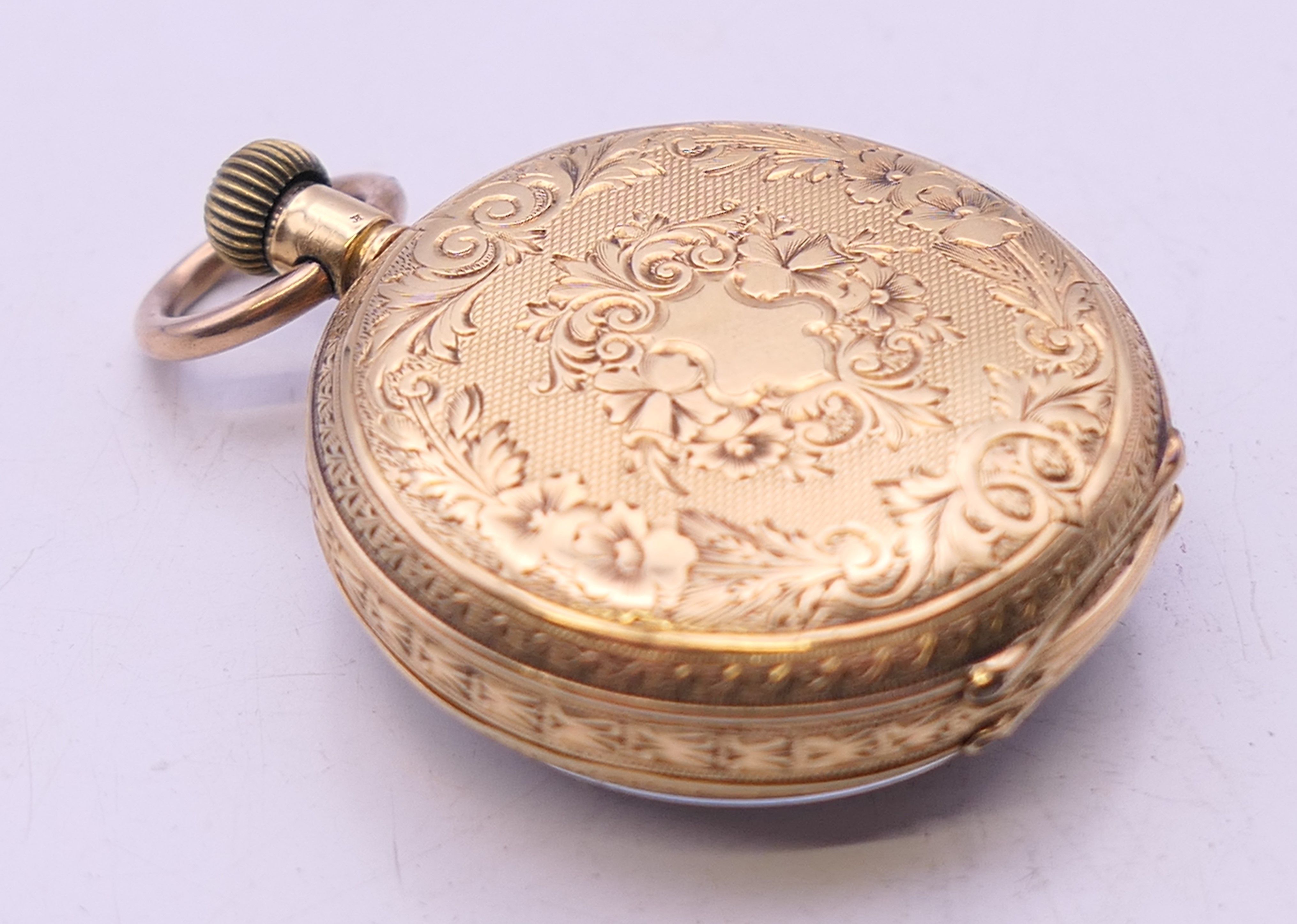 An 18 ct gold cased fob watch. 3.25 cm diameter. 31.7 grammes total weight. - Image 7 of 10
