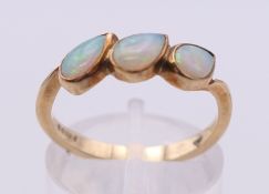 A 9 ct gold and opal ring. Ring size O.