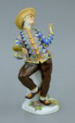 A Meissen porcelain figure. 19 cm high.