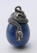 A silver and lapiz egg pendant bearing Russian marks. 2.5 cm high.