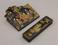 A Japanese lacquered pen box and a wall pocket. The former 20 cm long.