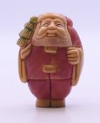 A small carving of Father Christmas. 4.5 cm high.