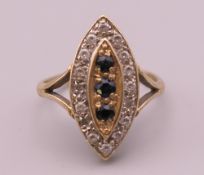 A 9 ct gold navette ring. Ring size O/P. 3.7 grammes total weight.