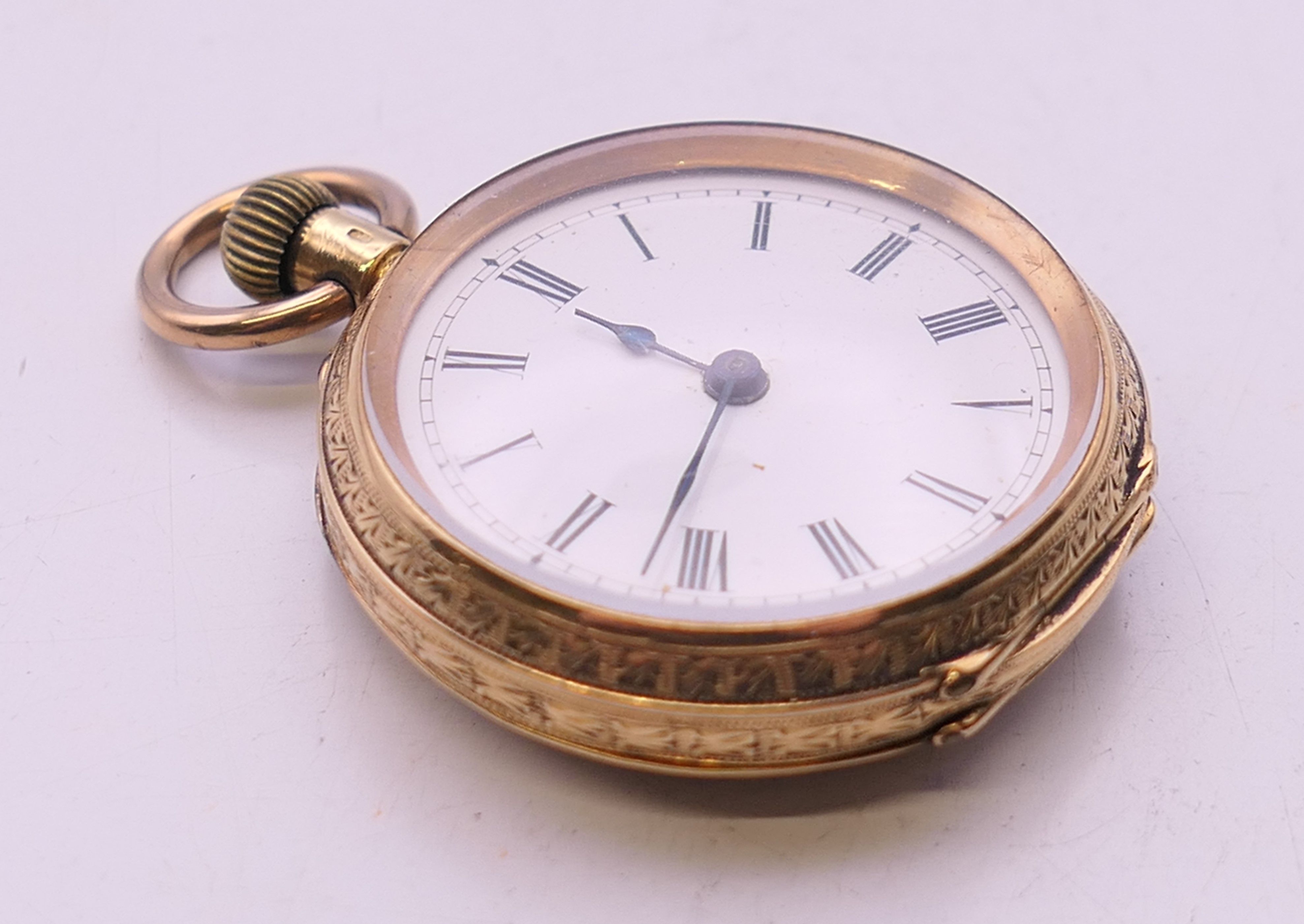 An 18 ct gold cased fob watch. 3.25 cm diameter. 31.7 grammes total weight. - Image 2 of 10