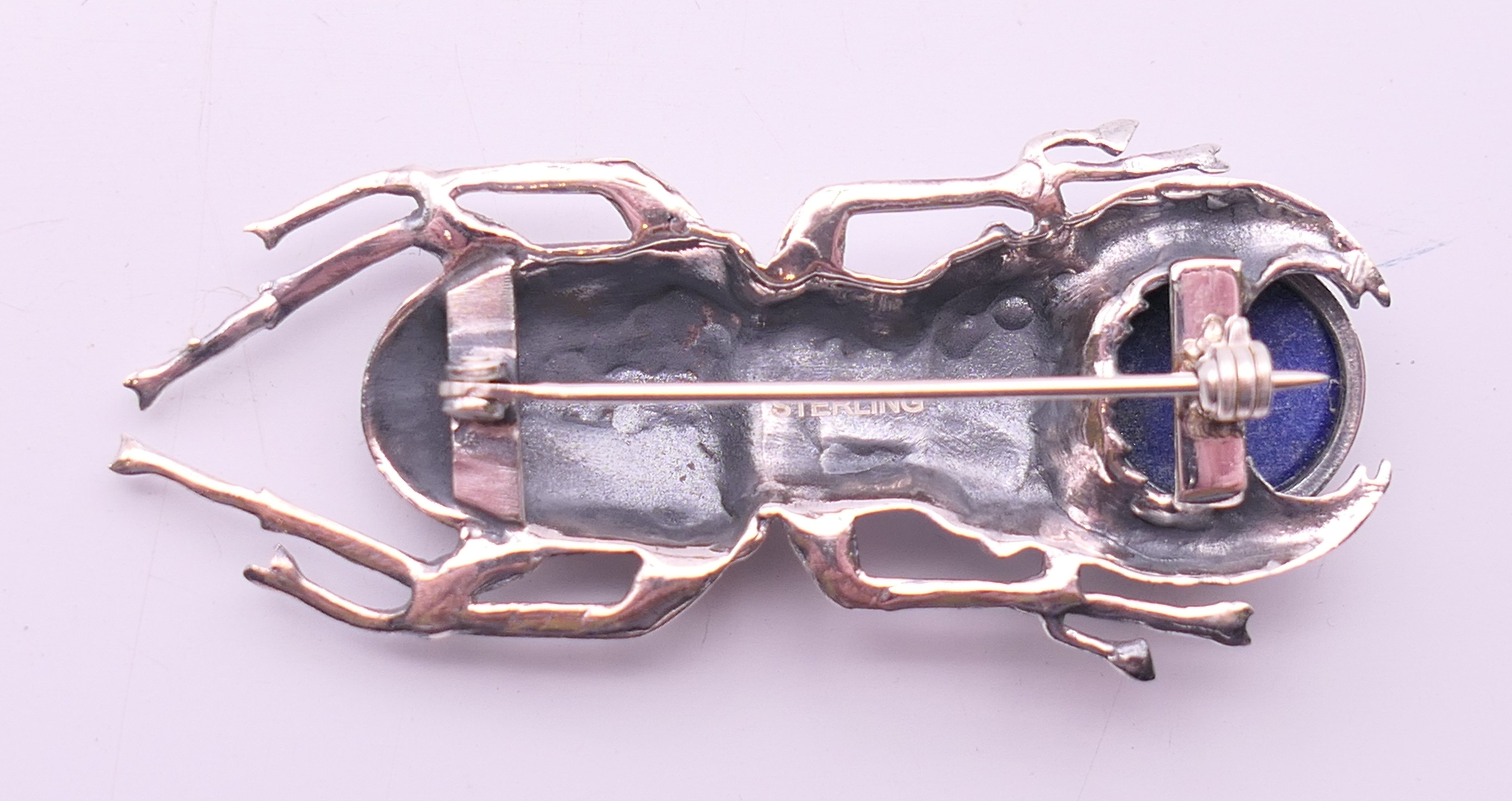 A silver and lapiz beetle brooch. 5.5 cm long. - Image 3 of 4