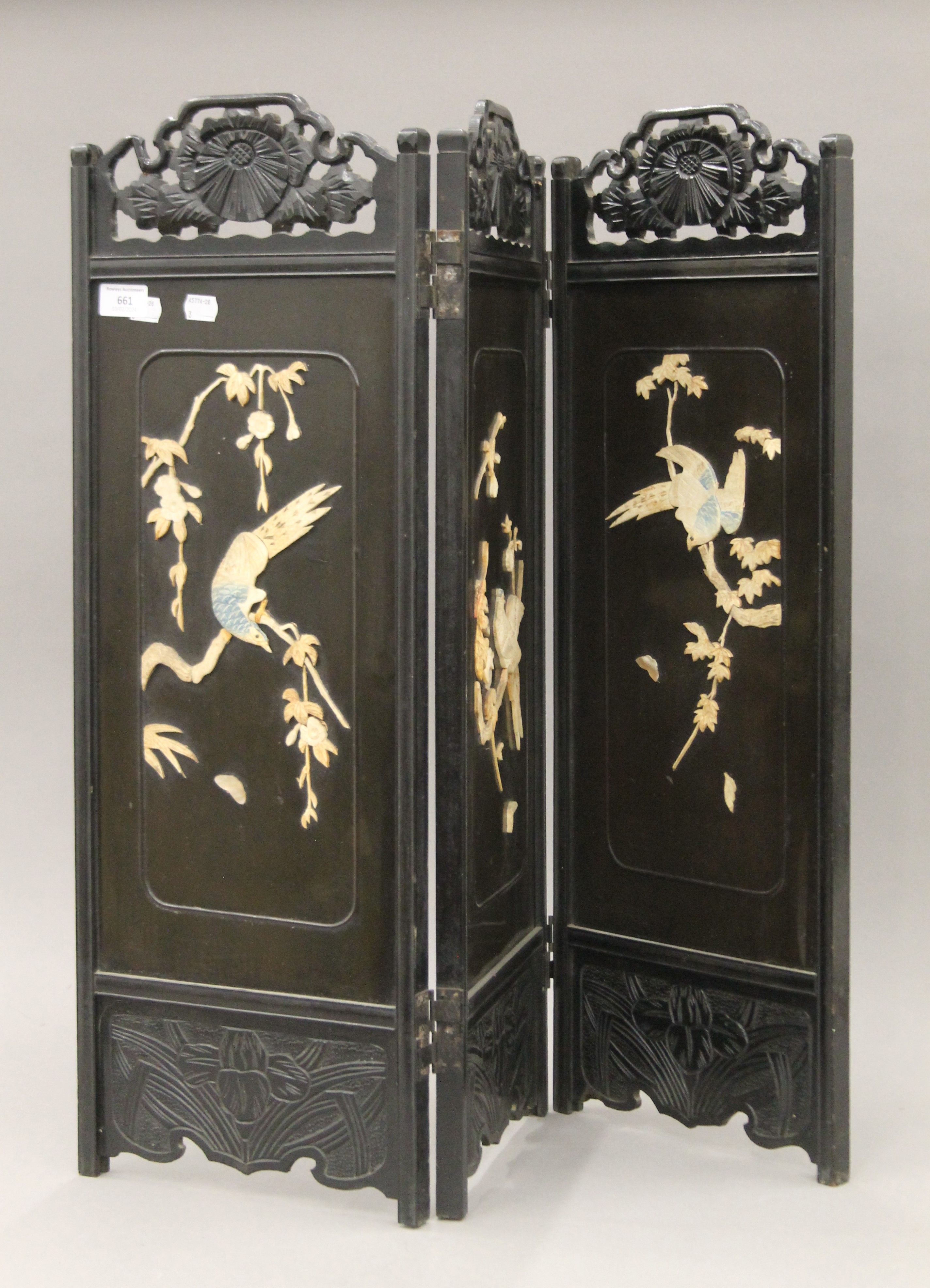 An antique Chinese carved folding screen with mother of pearl and bone decoration. 73 cm high.