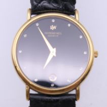 A Raymond Weil 18 K gold plated gentleman's wristwatch. 3 cm wide.