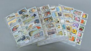 A quantity of cigarette card sets, including Players Curious Beaks and Cries of London,
